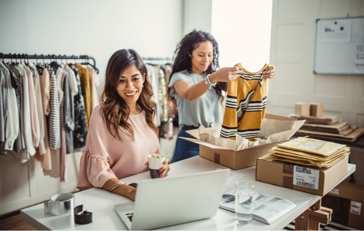 boutique owners packing boxes